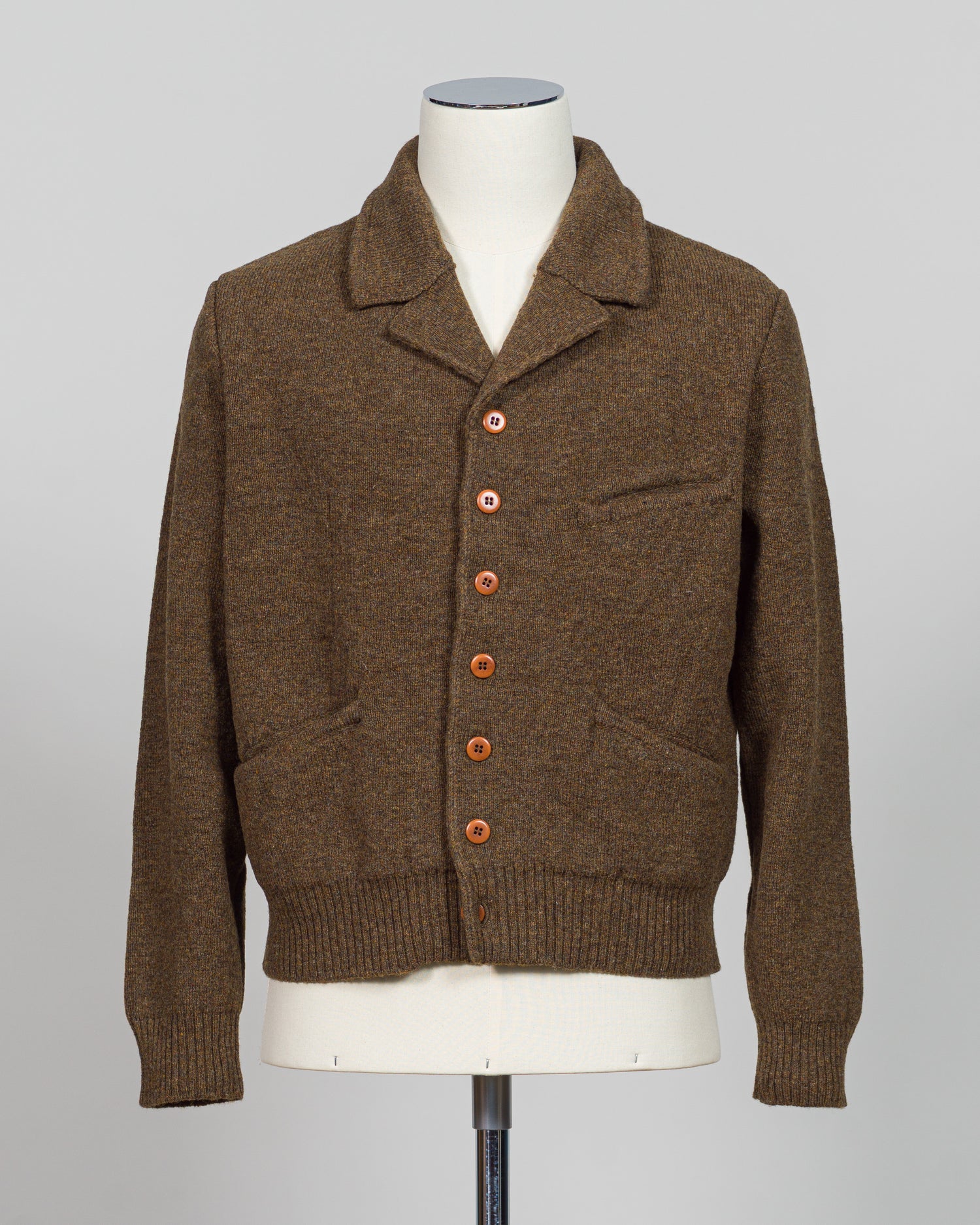 A masterful collaboration between G.R.P. Firenze and Max Rohr, this knitted wool jacket merges Italian craftsmanship with contemporary design. The rich brown tone offers versatile styling across seasons, while the structured knit construction provides both warmth and refined elegance. Perfect for layering or wearing as a statement piece, this jacket embodies the luxury menswear aesthetic with its understated sophistication and impeccable attention to detail.