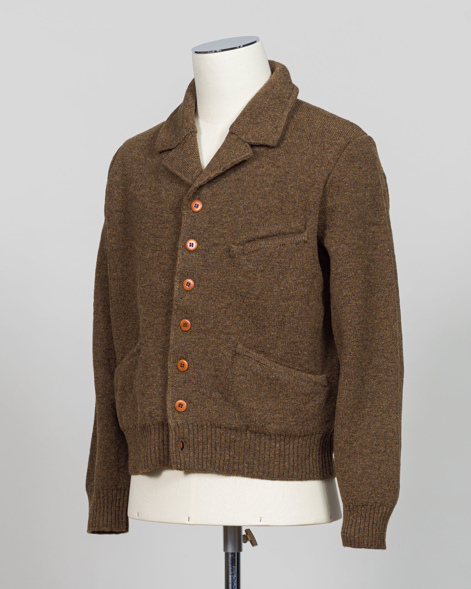 A masterful collaboration between G.R.P. Firenze and Max Rohr, this knitted wool jacket merges Italian craftsmanship with contemporary design. The rich brown tone offers versatile styling across seasons, while the structured knit construction provides both warmth and refined elegance. Perfect for layering or wearing as a statement piece, this jacket embodies the luxury menswear aesthetic with its understated sophistication and impeccable attention to detail.