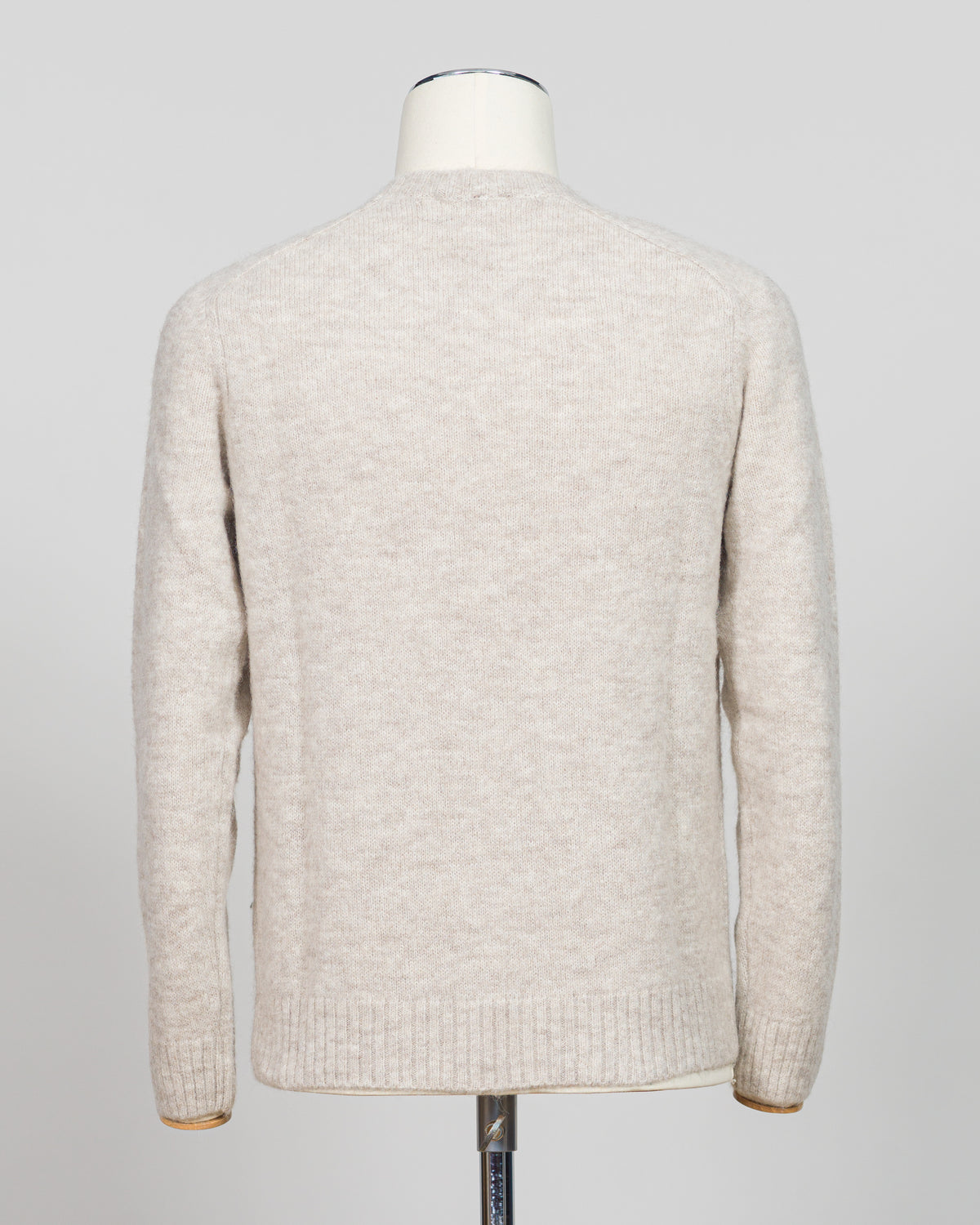 Effortless layering meets understated elegance with the FLY3 Raglan Crewneck Knit. The classic raglan silhouette drapes naturally across the shoulders, creating a relaxed fit that works equally well over a crisp dress shirt or worn solo. Crafted in a neutral oatmeal tone, this piece anchors any wardrobe—from business casual to weekend wear. The crew neckline and premium knit construction ensure lasting comfort and durability, making it a versatile staple for year-round styling.