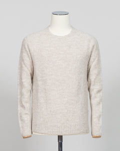 Effortless layering meets understated elegance with the FLY3 Raglan Crewneck Knit. The classic raglan silhouette drapes naturally across the shoulders, creating a relaxed fit that works equally well over a crisp dress shirt or worn solo. Crafted in a neutral oatmeal tone, this piece anchors any wardrobe—from business casual to weekend wear. The crew neckline and premium knit construction ensure lasting comfort and durability, making it a versatile staple for year-round styling.