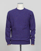 Harley of Scotland's iconic shaggy crew neck sweater in iris. Hand-knitted using traditional Scottish techniques, this piece features a distinctive textured surface that catches light beautifully while delivering exceptional softness against the skin. The relaxed crew neck silhouette works seamlessly as a standalone layer or under tailored blazers for refined versatility.

Premium wool construction provides natural warmth and breathability across seasons. The generous shag pile creates visual depth and tact