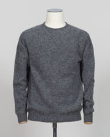 Harley of Scotland's iconic shaggy crew neck sweater in basalt. Hand-knitted using traditional Scottish techniques, this piece features a distinctive textured surface that catches light beautifully while delivering exceptional softness against the skin. The relaxed crew neck silhouette works seamlessly as a standalone layer or under tailored blazers for refined versatility.

Premium wool construction provides natural warmth and breathability across seasons. The generous shag pile creates visual depth and ta