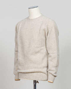 Harley of Scotland's iconic shaggy crew neck sweater in basalt. Hand-knitted using traditional Scottish techniques, this piece features a distinctive textured surface that catches light beautifully while delivering exceptional softness against the skin. The relaxed crew neck silhouette works seamlessly as a standalone layer or under tailored blazers for refined versatility.

Premium wool construction provides natural warmth and breathability across seasons. The generous shag pile creates visual depth and ta