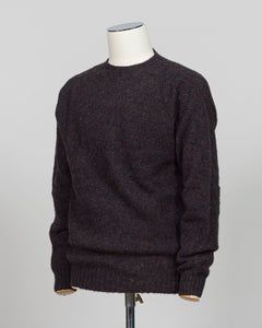 Harley of Scotland's iconic shaggy crew neck sweater in volcano. Hand-knitted using traditional Scottish techniques, this piece features a distinctive textured surface that catches light beautifully while delivering exceptional softness against the skin. The relaxed crew neck silhouette works seamlessly as a standalone layer or under tailored blazers for refined versatility.

Premium wool construction provides natural warmth and breathability across seasons. The generous shag pile creates visual depth and t