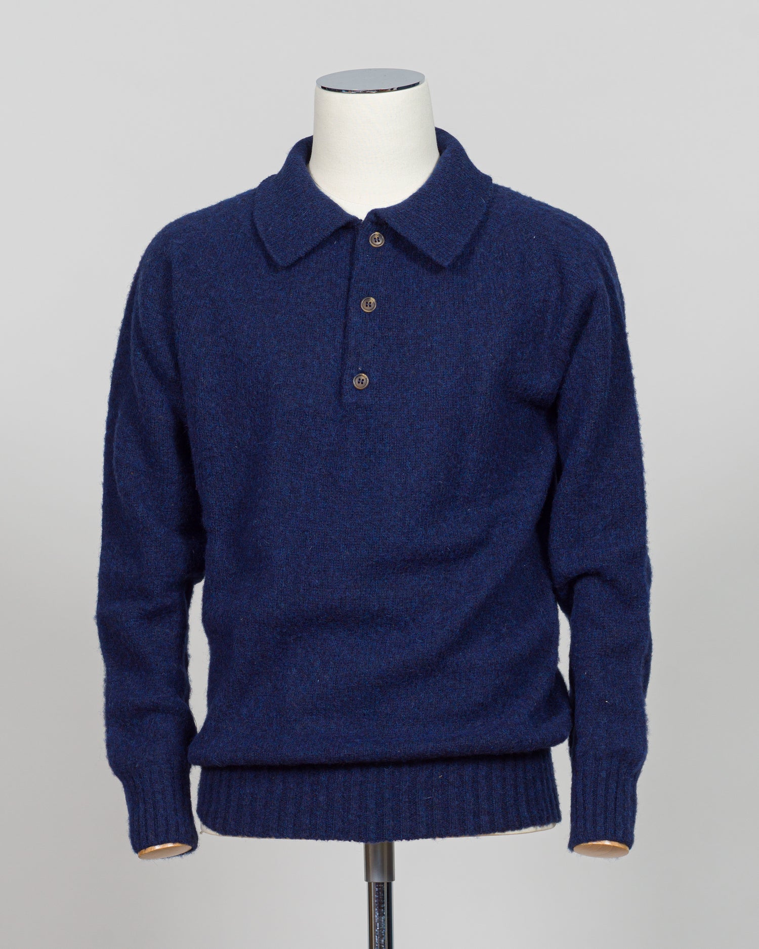 Crafted from luxurious shaggy wool, this Harley of Scotland polo combines traditional Scottish heritage with refined versatility. The textured knit delivers exceptional softness and warmth. Perfect for layering or wearing standalone, it transitions seamlessly from casual weekends to smart-casual occasions. The structured polo collar and quality construction ensure lasting appeal season after season.