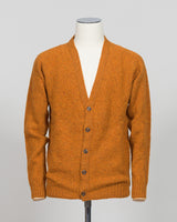 A timeless shaggy cardigan from Harley of Scotland, crafted in luxurious amber wool. This investment piece features a distinctive textured knit that adds depth and character to any wardrobe. Perfect for layering over shirts or wearing as a standalone statement, it delivers the rugged sophistication that defines Scottish knitwear heritage. The relaxed fit and substantial construction ensure years of wear, making it an essential addition to a refined menswear collection.