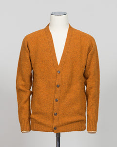 A timeless shaggy cardigan from Harley of Scotland, crafted in luxurious amber wool. This investment piece features a distinctive textured knit that adds depth and character to any wardrobe. Perfect for layering over shirts or wearing as a standalone statement, it delivers the rugged sophistication that defines Scottish knitwear heritage. The relaxed fit and substantial construction ensure years of wear, making it an essential addition to a refined menswear collection.