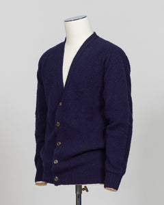 A timeless shaggy cardigan from Harley of Scotland, crafted in luxurious navy wool. This investment piece features a distinctive textured knit that adds depth and character to any wardrobe. Perfect for layering over shirts or wearing as a standalone statement, it delivers the rugged sophistication that defines Scottish knitwear heritage. The relaxed fit and substantial construction ensure years of wear, making it an essential addition to a refined menswear collection.