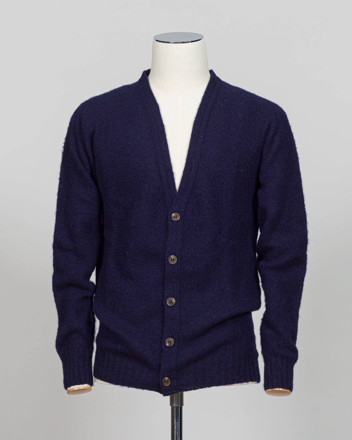 A timeless shaggy cardigan from Harley of Scotland, crafted in luxurious navy wool. This investment piece features a distinctive textured knit that adds depth and character to any wardrobe. Perfect for layering over shirts or wearing as a standalone statement, it delivers the rugged sophistication that defines Scottish knitwear heritage. The relaxed fit and substantial construction ensure years of wear, making it an essential addition to a refined menswear collection.