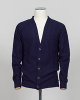 A timeless shaggy cardigan from Harley of Scotland, crafted in luxurious navy wool. This investment piece features a distinctive textured knit that adds depth and character to any wardrobe. Perfect for layering over shirts or wearing as a standalone statement, it delivers the rugged sophistication that defines Scottish knitwear heritage. The relaxed fit and substantial construction ensure years of wear, making it an essential addition to a refined menswear collection.
