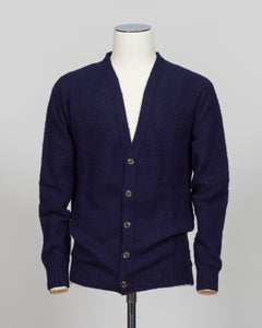 A timeless shaggy cardigan from Harley of Scotland, crafted in luxurious navy wool. This investment piece features a distinctive textured knit that adds depth and character to any wardrobe. Perfect for layering over shirts or wearing as a standalone statement, it delivers the rugged sophistication that defines Scottish knitwear heritage. The relaxed fit and substantial construction ensure years of wear, making it an essential addition to a refined menswear collection.