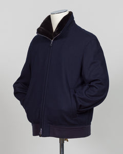 The Montecore Blouson Jacket exemplifies modern tailoring with its refined silhouette and versatile navy colorway. Crafted from premium materials, this blouson delivers structured elegance suitable for both professional and refined casual settings.

The jacket features a contemporary fit that balances comfort with polished aesthetics. Its streamlined design works seamlessly layered over knitwear or worn as a standalone piece, making it an essential addition to a curated wardrobe.

Ideal for the discerning g