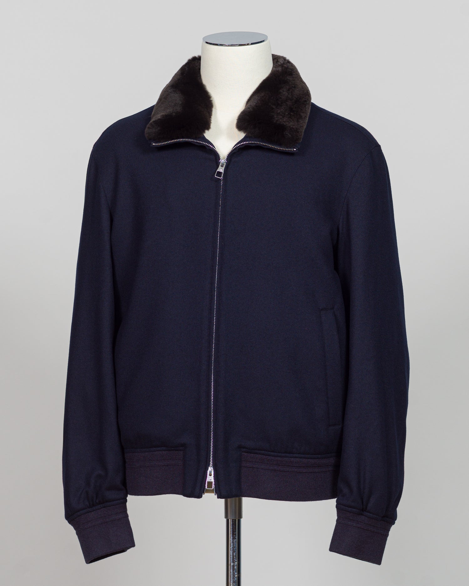 The Montecore Blouson Jacket exemplifies modern tailoring with its refined silhouette and versatile navy colorway. Crafted from premium materials, this blouson delivers structured elegance suitable for both professional and refined casual settings.

The jacket features a contemporary fit that balances comfort with polished aesthetics. Its streamlined design works seamlessly layered over knitwear or worn as a standalone piece, making it an essential addition to a curated wardrobe.

Ideal for the discerning g