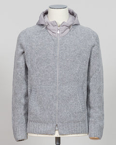 A relaxed layering essential in sumptuous bouclé knit. Gran Sasso's full-zip hoodie bridges the gap between structured knitwear and effortless comfort—perfect for weekend dressing or layering over basics. The light grey tone pairs seamlessly with tailored trousers or casual denim. Italian craftsmanship meets approachable luxury in a piece that works as hard as you do. Gran Sasso Full-Zip Bouclé Hoodie / Light Grey