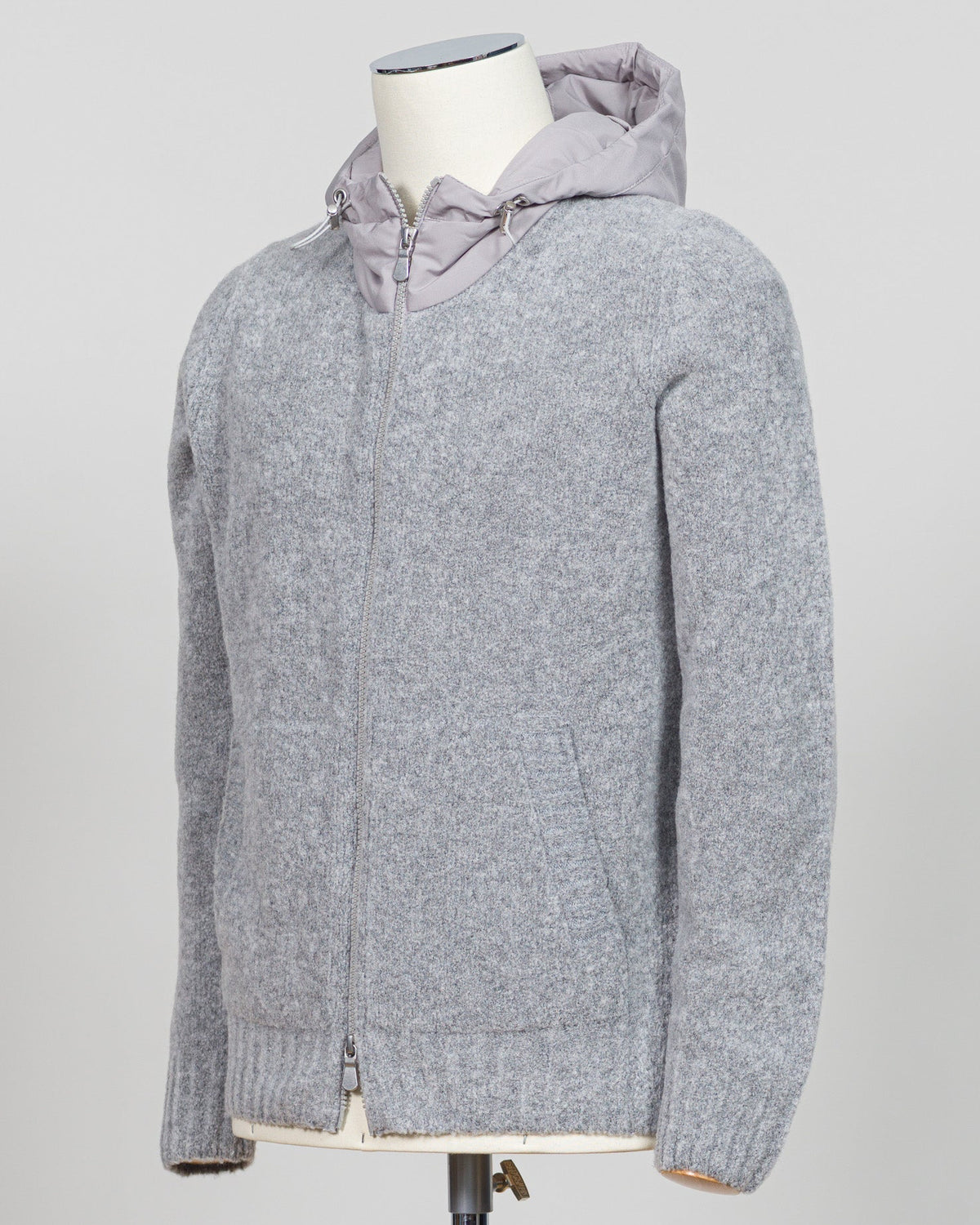 A relaxed layering essential in sumptuous bouclé knit. Gran Sasso's full-zip hoodie bridges the gap between structured knitwear and effortless comfort—perfect for weekend dressing or layering over basics. The light grey tone pairs seamlessly with tailored trousers or casual denim. Italian craftsmanship meets approachable luxury in a piece that works as hard as you do. Gran Sasso Full-Zip Bouclé Hoodie / Light Grey