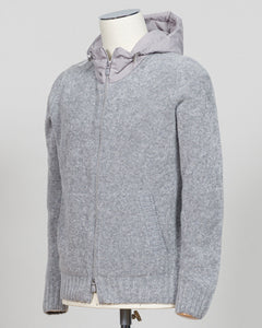 A relaxed layering essential in sumptuous bouclé knit. Gran Sasso's full-zip hoodie bridges the gap between structured knitwear and effortless comfort—perfect for weekend dressing or layering over basics. The light grey tone pairs seamlessly with tailored trousers or casual denim. Italian craftsmanship meets approachable luxury in a piece that works as hard as you do. Gran Sasso Full-Zip Bouclé Hoodie / Light Grey