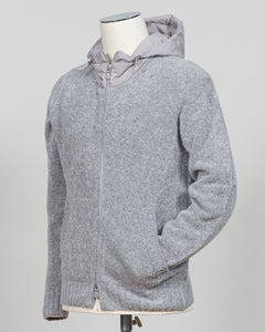 A relaxed layering essential in sumptuous bouclé knit. Gran Sasso's full-zip hoodie bridges the gap between structured knitwear and effortless comfort—perfect for weekend dressing or layering over basics. The light grey tone pairs seamlessly with tailored trousers or casual denim. Italian craftsmanship meets approachable luxury in a piece that works as hard as you do. Gran Sasso Full-Zip Bouclé Hoodie / Light Grey