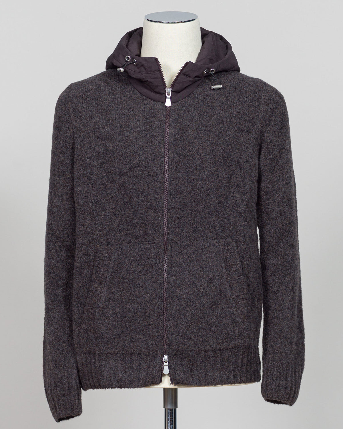 Luxurious bouclé hoodie in rich brown. Full-zip construction with a soft, textured knit that defines effortless sophistication. Perfect for layering or standalone wear. Italian craftsmanship meets contemporary comfort—a premium essential for the discerning wardrobe. Gran Sasso Full-Zip Bouclé Hoodie / Brown