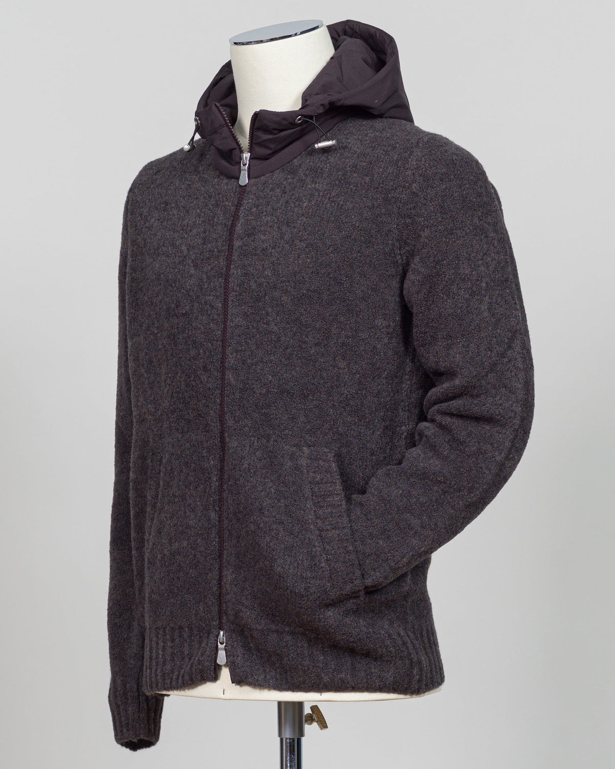 Luxurious bouclé hoodie in rich brown. Full-zip construction with a soft, textured knit that defines effortless sophistication. Perfect for layering or standalone wear. Italian craftsmanship meets contemporary comfort—a premium essential for the discerning wardrobe. Gran Sasso Full-Zip Bouclé Hoodie / Brown