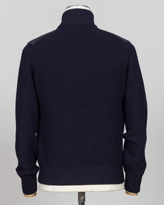 A dark navy blue ribbed knit sweater shown from the back on a mannequin, featuring shoulder patchwork detailing and a mock neck. talian wool craftsmanship meets contemporary tailoring in this Gran Sasso sartorial padded jacket. Structured in premium wool with subtle padding for refined warmth, it pairs effortlessly with business wear or elevated casual styling. Gran Sasso Sartorial Padded &nbsp;Wool Jacket / Navy