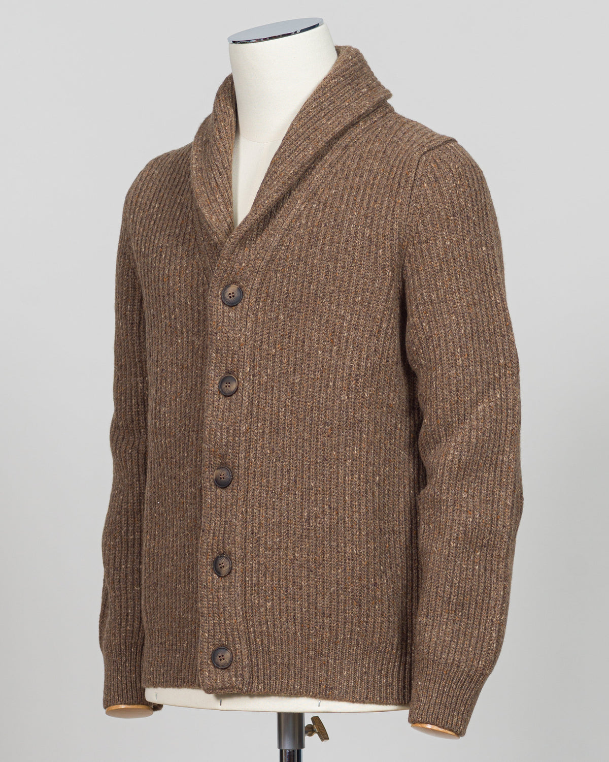 A brown ribbed knit cardigan sweater with a shawl collar and dark buttons, displayed on a cream mannequin torso against a light gray background.