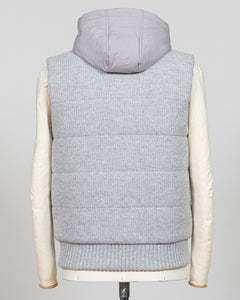 Lightweight insulation meets refined elegance in this Gran Sasso padded hooded vest. The soft light grey colourway pairs seamlessly with layered knitwear or worn solo over shirts for versatile warmth. Italian craftsmanship ensures a tailored silhouette that bridges casual and smart-casual dressing. Essential for the discerning wardrobe. Gran Sasso Padded Hooded Vest / Light Grey