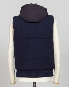 Lightweight padded hooded vest in deep navy. Crafted by Gran Sasso, this essential layer offers sophisticated warmth without bulk. Perfect layered over knitwear or worn standalone for refined, modern styling. Premium construction ensures lasting comfort and durability. Gran Sasso Padded Hooded Vest / Navy
