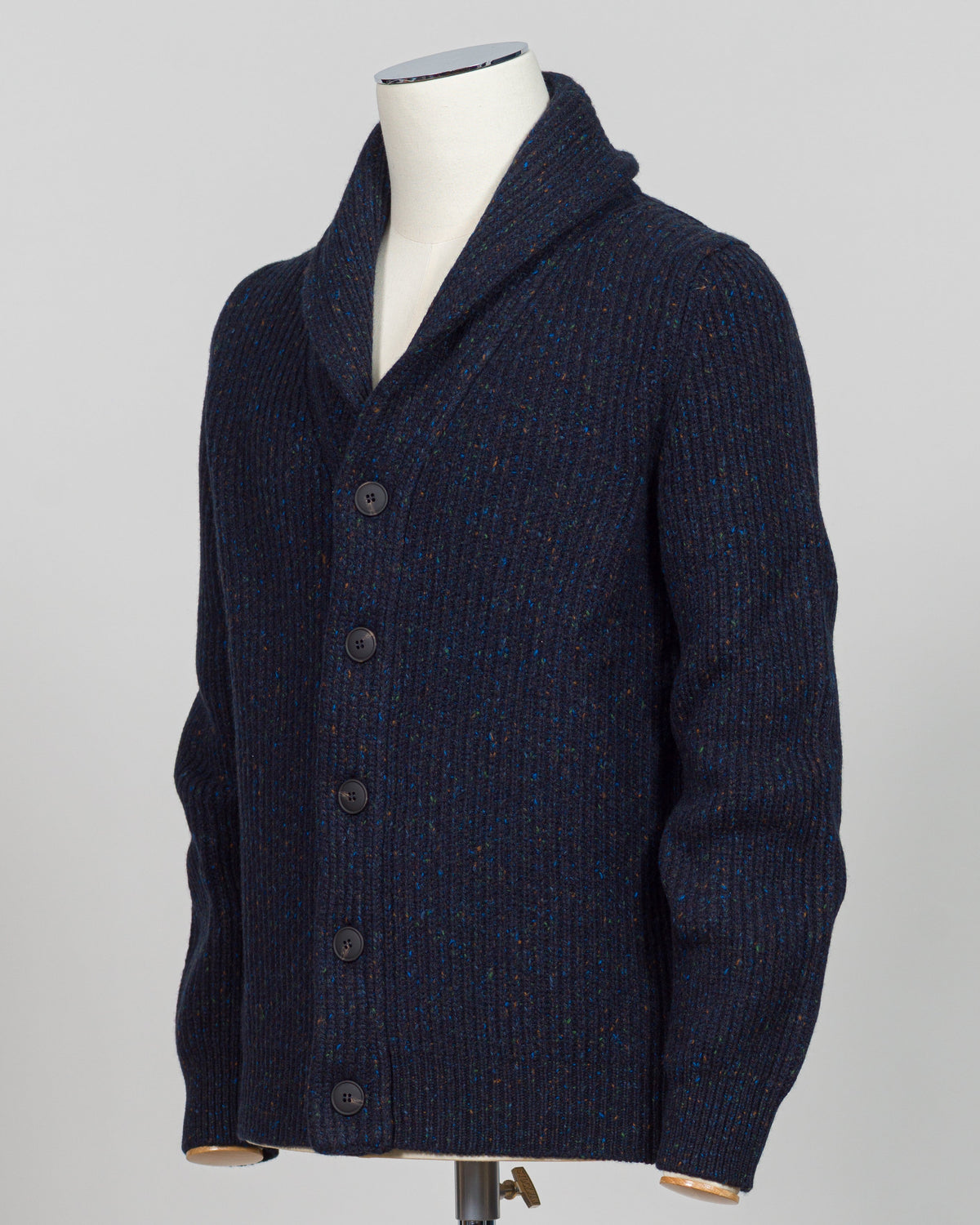 A dark navy blue knit polo sweater with subtle multicolor flecks, displayed on a white mannequin torso against a light gray background.