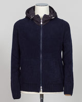 Luxurious bouclé knit in a refined navy shade. Full-zip construction with a relaxed fit ideal for layering or standalone wear. Crafted from premium Italian yarn for exceptional texture and durability. A versatile essential that bridges casual and sophisticated styling. Gran Sasso Full-Zip Bouclé Hoodie / Navy