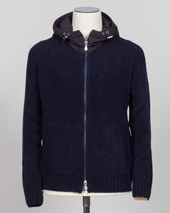Luxurious bouclé knit in a refined navy shade. Full-zip construction with a relaxed fit ideal for layering or standalone wear. Crafted from premium Italian yarn for exceptional texture and durability. A versatile essential that bridges casual and sophisticated styling. Gran Sasso Full-Zip Bouclé Hoodie / Navy