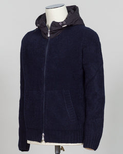 Luxurious bouclé knit in a refined navy shade. Full-zip construction with a relaxed fit ideal for layering or standalone wear. Crafted from premium Italian yarn for exceptional texture and durability. A versatile essential that bridges casual and sophisticated styling. Gran Sasso Full-Zip Bouclé Hoodie / Navy