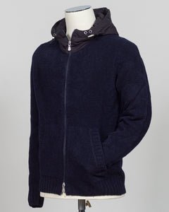 Luxurious bouclé knit in a refined navy shade. Full-zip construction with a relaxed fit ideal for layering or standalone wear. Crafted from premium Italian yarn for exceptional texture and durability. A versatile essential that bridges casual and sophisticated styling. Gran Sasso Full-Zip Bouclé Hoodie / Navy