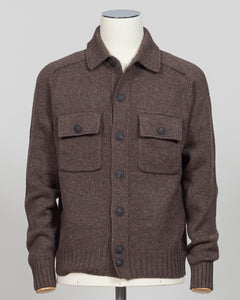A brown knit button-front cardigan sweater with a collar and two flap chest pockets, displayed on a mannequin torso against a light gray studio background.