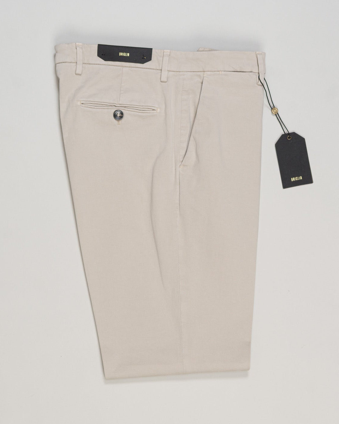 Lightweight cotton chinos in soft light beige by Briglia. Clean lines and refined construction deliver understated elegance for everyday wear and business casual settings. The breathable fabric moves with you, while precise tailoring ensures a sharp silhouette. A versatile essential that pairs effortlessly with both knitwear and dress shirts. Briglia Naviglio Cotton Chinos / Light Beige