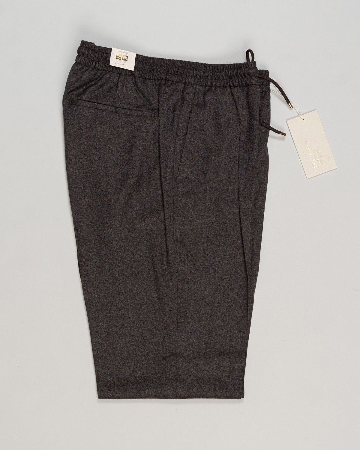 Refined Italian tailoring meets relaxed elegance. Briglia's drawstring flannel trousers deliver understated sophistication—structured yet forgiving, with a fluid drape that works across seasons. The soft flannel fabric ages beautifully, while the adjustable waist ensures a personalized fit. A versatile foundation for refined casual wardrobes. Briglia Drawstring Flannel Trousers / Brown