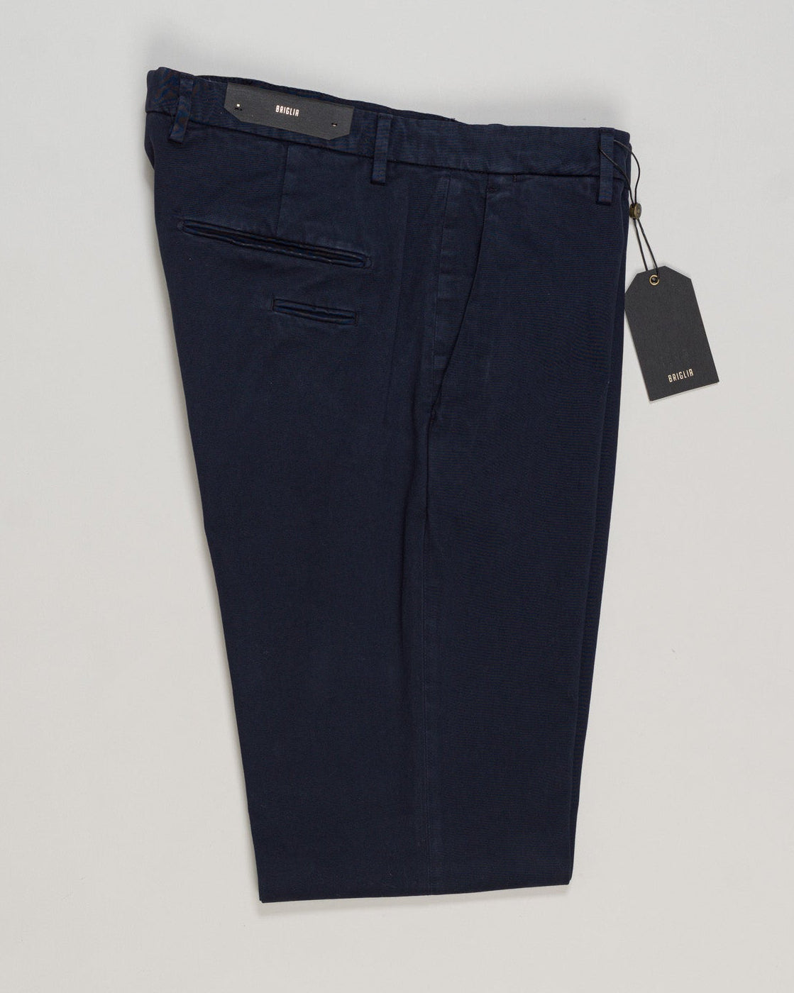 Briglia's garment-dyed cotton chinos deliver understated Italian craftsmanship in a versatile navy that pairs effortlessly with any wardrobe. The soft, pre-washed cotton develops character with wear, offering a relaxed yet refined silhouette perfect for both casual weekends and smart-casual occasions. Premium construction and attention to detail make these a timeless staple for the discerning gentleman. Briglia Garment Dyed Cotton Chinos / Navy