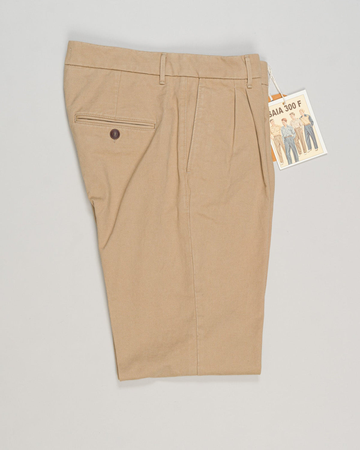 Refined cotton gabardine trousers crafted with precision tailoring. Classic beige tone works seamlessly with knitwear and structured blazers. Flat front with side pockets, finished with a contemporary taper. Ideal for elevated everyday wear and professional settings. Tela Genova Gabardine Trousers / Beige