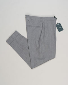 Crafted from a refined blend of wool and cotton, these Berwich trousers exemplify Italian tailoring at its finest. The long-staple gabardine weave delivers a subtle lustre and exceptional drape, while the balanced fibre composition ensures breathability and durability across seasons.

The versatile grey tone pairs seamlessly with sport coats, knitwear, and tailored jackets. Clean lines and a measured cut reflect contemporary menswear proportions without compromise on classic elegance.

A foundation piece fo