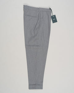 Crafted from a refined blend of wool and cotton, these Berwich trousers exemplify Italian tailoring at its finest. The long-staple gabardine weave delivers a subtle lustre and exceptional drape, while the balanced fibre composition ensures breathability and durability across seasons.

The versatile grey tone pairs seamlessly with sport coats, knitwear, and tailored jackets. Clean lines and a measured cut reflect contemporary menswear proportions without compromise on classic elegance.

A foundation piece fo