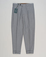 Crafted from a refined blend of wool and cotton, these Berwich trousers exemplify Italian tailoring at its finest. The long-staple gabardine weave delivers a subtle lustre and exceptional drape, while the balanced fibre composition ensures breathability and durability across seasons.

The versatile grey tone pairs seamlessly with sport coats, knitwear, and tailored jackets. Clean lines and a measured cut reflect contemporary menswear proportions without compromise on classic elegance.

A foundation piece fo