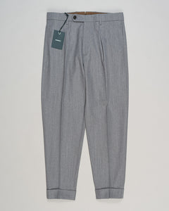 Crafted from a refined blend of wool and cotton, these Berwich trousers exemplify Italian tailoring at its finest. The long-staple gabardine weave delivers a subtle lustre and exceptional drape, while the balanced fibre composition ensures breathability and durability across seasons.

The versatile grey tone pairs seamlessly with sport coats, knitwear, and tailored jackets. Clean lines and a measured cut reflect contemporary menswear proportions without compromise on classic elegance.

A foundation piece fo