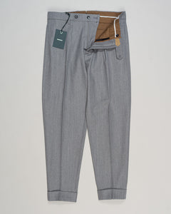 Crafted from a refined blend of wool and cotton, these Berwich trousers exemplify Italian tailoring at its finest. The long-staple gabardine weave delivers a subtle lustre and exceptional drape, while the balanced fibre composition ensures breathability and durability across seasons.

The versatile grey tone pairs seamlessly with sport coats, knitwear, and tailored jackets. Clean lines and a measured cut reflect contemporary menswear proportions without compromise on classic elegance.

A foundation piece fo