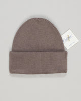 A refined wool watch cap in warm taupe, crafted for understated elegance and everyday versatility. The tightly knit construction offers structure and durability, while the soft wool blend provides comfort through seasons.&nbsp;