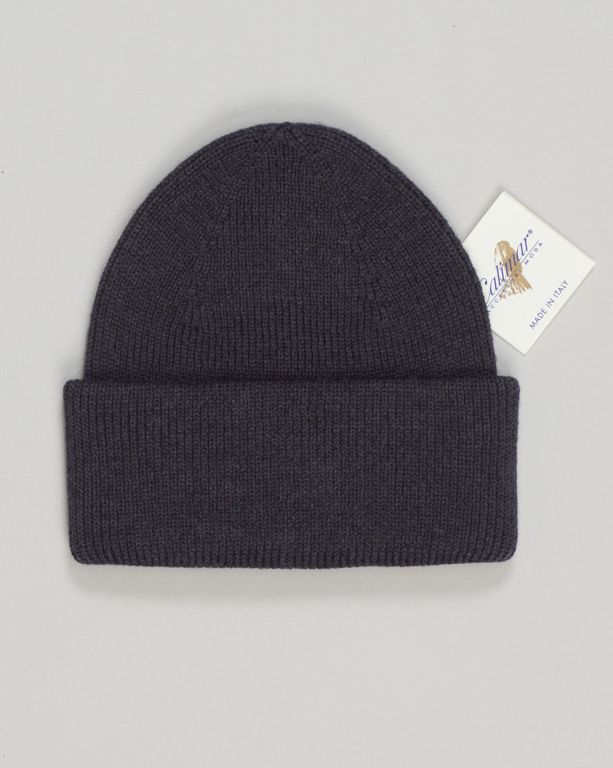 A refined wool watch cap in sophisticated anthracite. Clean lines and a timeless silhouette make it an essential accessory for any season. The natural warmth and breathability of quality wool provide comfort whether you're navigating urban streets or countryside air. Simple, understated, and built to last. Calimar Wool Watch Cap / Anthracite