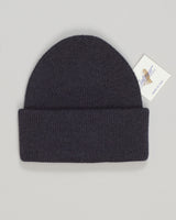 A refined wool watch cap in sophisticated anthracite. Clean lines and a timeless silhouette make it an essential accessory for any season. The natural warmth and breathability of quality wool provide comfort whether you're navigating urban streets or countryside air. Simple, understated, and built to last. Calimar Wool Watch Cap / Anthracite