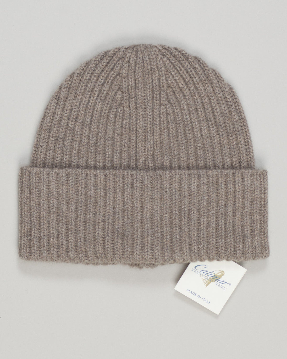 Crafted from pure cashmere, this beanie delivers luxurious warmth and timeless elegance. The soft taupe tone pairs effortlessly with any wardrobe—a versatile essential for season after season. Fine-gauge construction ensures a refined drape and comfortable fit that moves with you. Calimar Cashmere Beanie / Taupe
