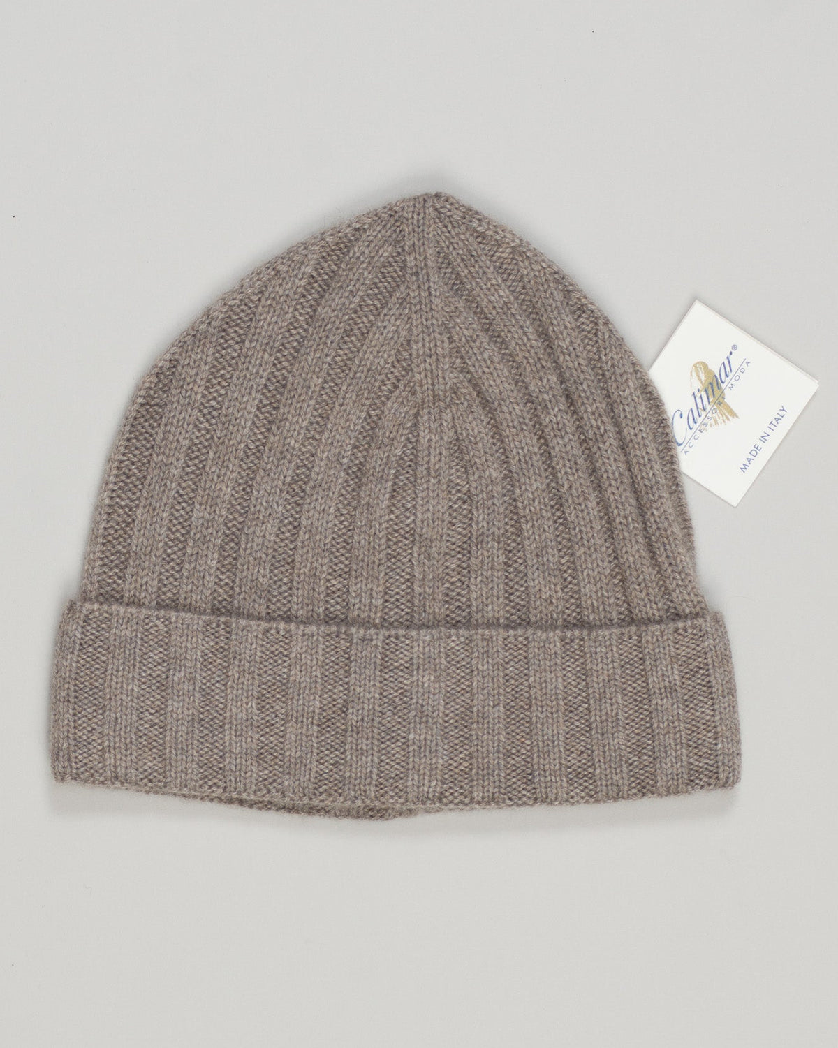 Luxurious warmth in a refined silhouette. Crafted from premium cashmere, this taupe beanie delivers understated elegance with exceptional softness. A timeless essential for year-round sophistication—perfect for transitional seasons or adding subtle texture to your daily rotation. Calimar Light Cashmere Beanie / Taupe