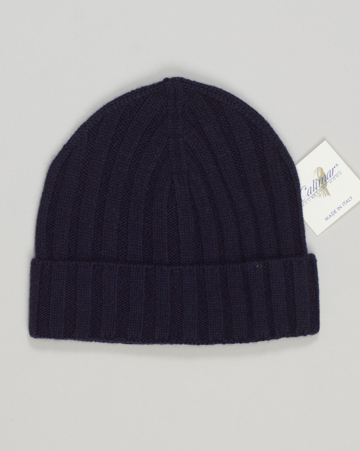 Refined luxury meets everyday comfort in this lightweight cashmere beanie. Hand-finished in rich navy, it delivers the warmth and softness of premium fibers without bulk. Perfect for layering beneath outerwear or wearing solo, this essential piece transitions seamlessly from season to season. Calimar Light Cashmere Beanie / Navy