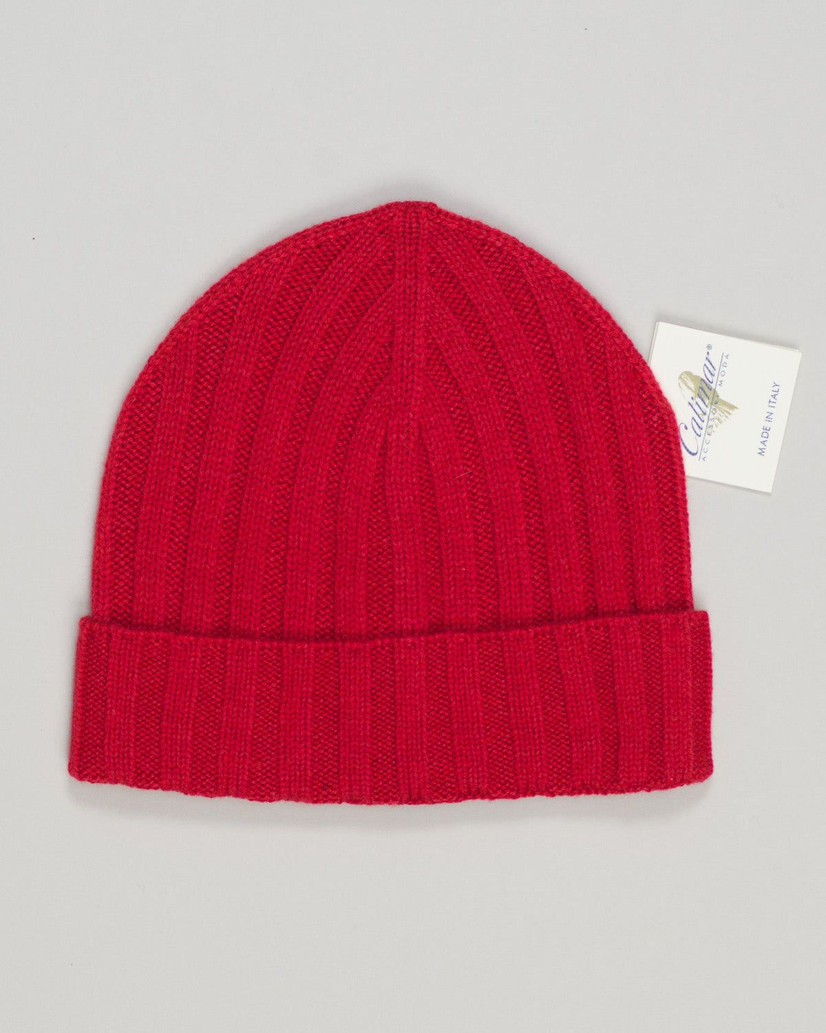 Refined wool blend beanie in rich red. Lightweight cashmere construction ensures breathability and softness against skin. Classic ribbed knit offers subtle texture and secure fit. Versatile enough for casual wear or as a finishing accent to any outfit. Calimar Light Cashmere Beanie / Red