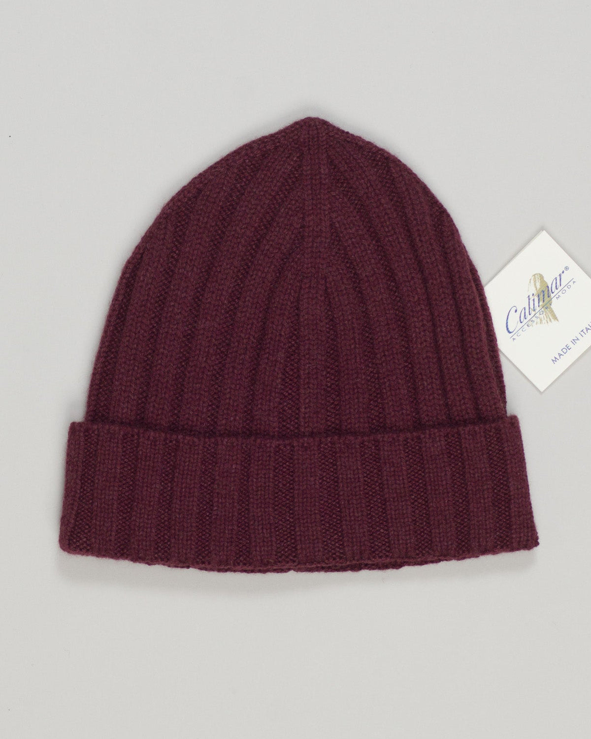 Sumptuous cashmere beanie in burgundy. Lightweight construction offers warmth without bulk, ideal for layering or standalone wear. Soft, breathable fiber maintains its shape through seasons. Perfect for refined everyday elegance. Calimar Light Cashmere Beanie / Burgundy